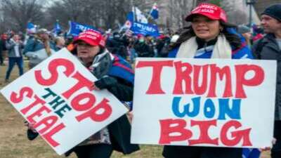 Trumpers holding signs saying, Trump won big! 
